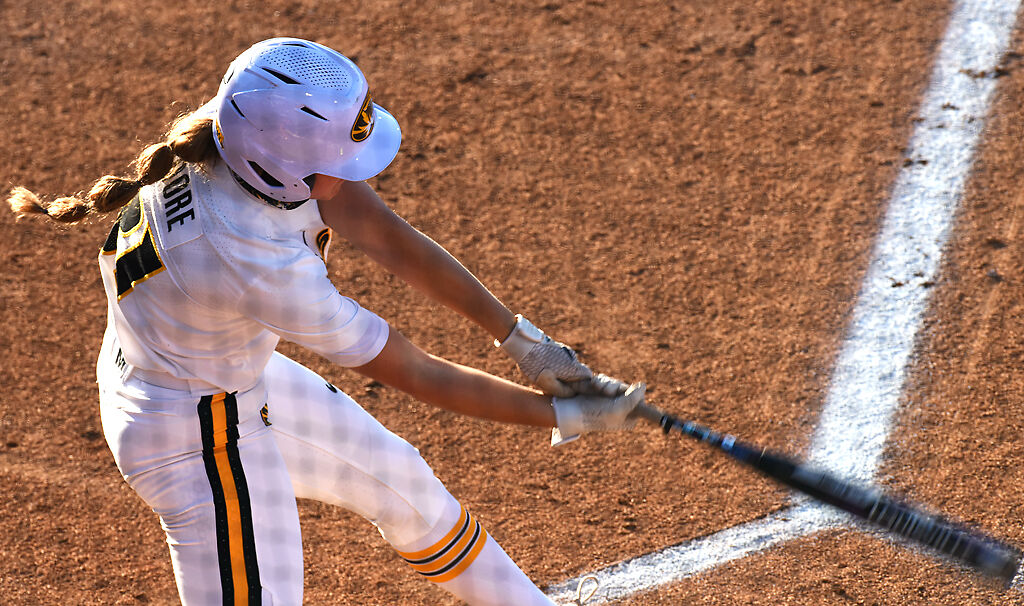 Hatti Moore swings over home plate